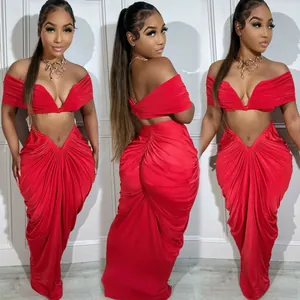 Detailed look at red two-piece ruched maxi skirt with off-shoulder crop top set