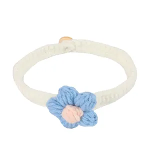 Handmade knitted pet collar with blue puff flower for cats and small dogs, soft yarn.