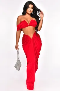 Sexy red strapless two-piece set with a ruched maxi skirt and off-shoulder crop top.