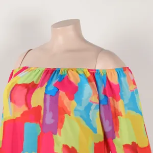 Close-up of vibrant abstract print off-the-shoulder dress with colorful brushstroke pattern