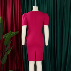 Detail view showing the back design and hem slit of this magenta ruffled pencil dress