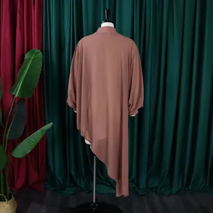 Back view of a loose chiffon dress with a stylish asymmetric irregular hem design