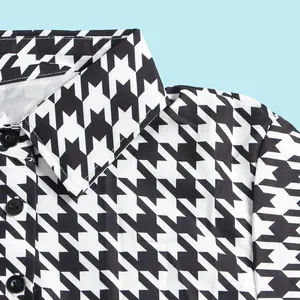 Close-up of black and white houndstooth pattern dress with classic lapel collar