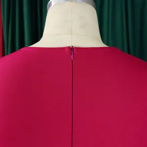 Detailed view of the back invisible zipper on a magenta elegant African bodycon dress.