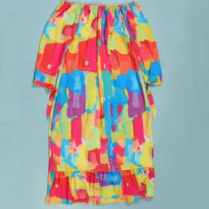Detailed view of colorful abstract watercolor print on off-the-shoulder long maxi dress