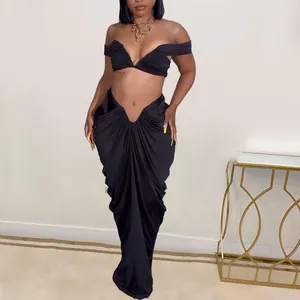 Seductive black two-piece outfit with off-shoulder crop top and ruched floor-length maxi skirt