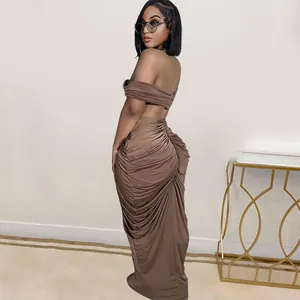 Side view of sexy off-shoulder ruched maxi skirt and crop top set in brown