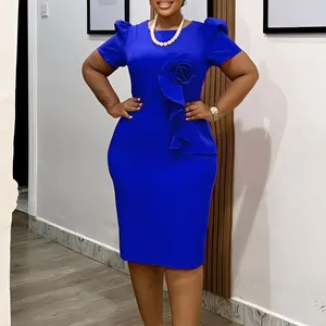 Close-up of elegant royal blue bodycon dress featuring 3D ruffle flower detail.