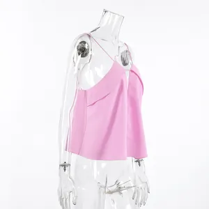 Side detail view of a pink linen camisole tank top displayed on a clear mannequin