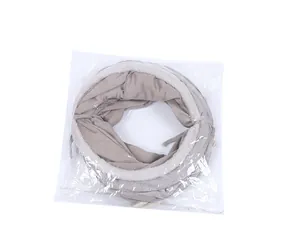 Folded grey suede cat tunnel toy with plush trim in transparent plastic packaging macro view