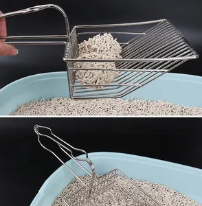 Detail view of large stainless steel cat litter scoop sifting clumped tofu litter in box.