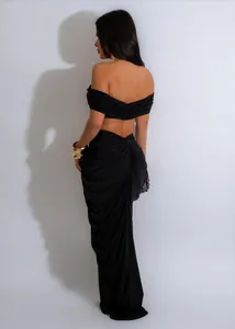 Detailed back view of a sexy black off-the-shoulder ruched maxi skirt two-piece set
