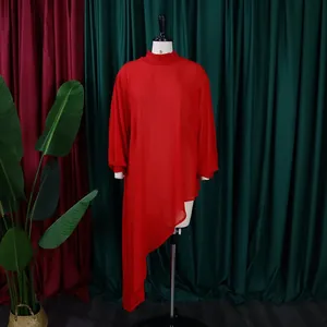 Detail view of a vibrant red loose-fit chiffon dress with a long asymmetrical hem.