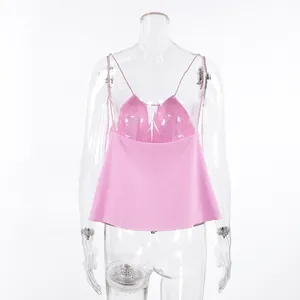 Back view of a pink linen camisole with thin straps on a transparent mannequin.