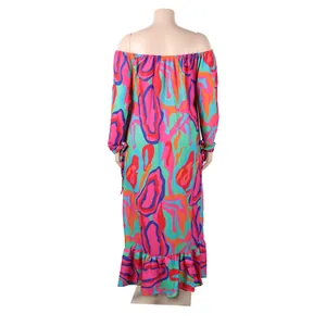 Detailed back view of off-the-shoulder maxi dress featuring colorful abstract patterns