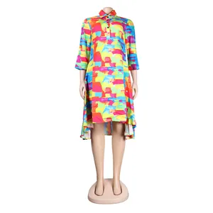 Vibrant colorful abstract print shirt dress with lapel collar and high-low hem line.