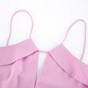 Close-up detail of pink linen camisole with thin spaghetti straps and V-neckline