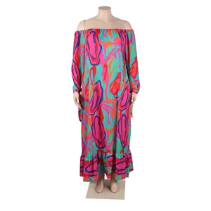 Close-up of vibrant abstract print and ruffle hem on a long sleeve maxi dress