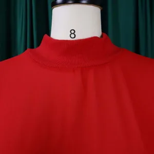 Close-up detail of elegant red chiffon dress mock neck with ribbed texture finish