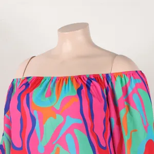 Detailed view of the colorful abstract wavy pattern on an off-the-shoulder dress neckline.