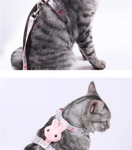 Detail shot of pink H-shaped cat harness with cute rabbit accessory on a gray tabby cat.