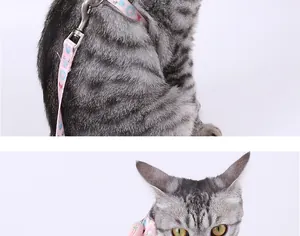 Detailed view of adjustable pink cat harness with rabbit prints on a grey tabby cat