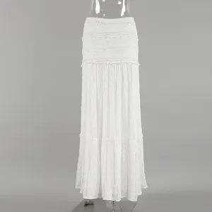 Full-length front view of a French Bohemian white lace A-line maxi skirt on a mannequin