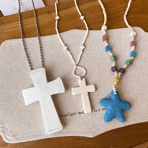 Bohemian style beaded long necklaces with stone cross and blue starfish pendants