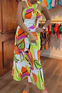 Close-up view of vibrant floral print sleeveless halter maxi dress with a slim fit