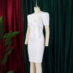 Elegant white bodycon dress featuring a decorative ruffle flower and short sleeves
