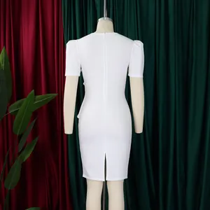 Back view of an elegant white bodycon dress with puff sleeves and rear slit detail