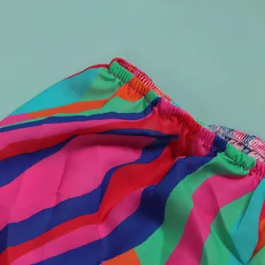 Detail view of colorful striped fabric with elasticated waistband for slim fit dress