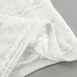 Detailed close-up showing the intricate white floral lace and smooth lining fabric