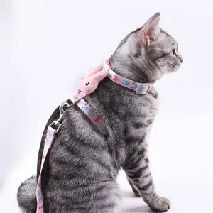 Adjustable pink H-shaped cat harness and leash set with cute 3D plush rabbit decoration.
