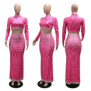 Roze tweedelige partyset met crop top met lange mouwen en strakke maxi-rok details