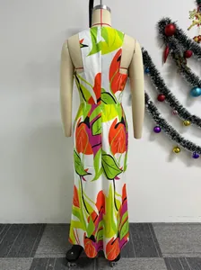 Detailed back view of a vibrant tropical leaf print sleeveless maxi dress on a mannequin