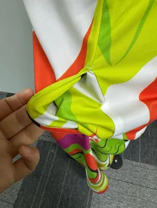 Detail view of the functional side pocket on a colorful printed sleeveless dress
