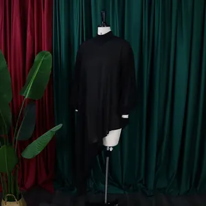 Elegant black chiffon asymmetrical dress with loose fit displayed on a mannequin