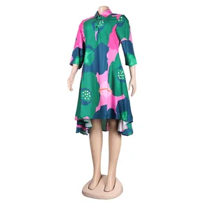 Colorful floral printed dress with high-low hem and classic collar on mannequin