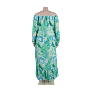 Back view of a green floral off-shoulder maxi dress with long sleeves and ruffled hem