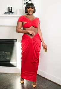 Detailed view of sexy red off-the-shoulder pleated crop top and maxi skirt two-piece set.