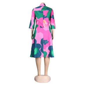 Back view of a vibrant colorful floral print slim-fit midi dress featuring 3/4 sleeves