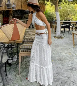 Bohemian white lace maxi skirt set with elegant tiered ruffles in garden setting