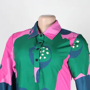 Close-up detail of a colorful abstract print dress featuring a classic turn-down collar