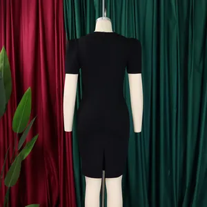 Detailed back view of an elegant black puff sleeve bodycon dress with a split hem