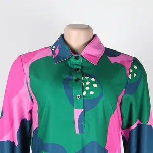 Detailed close-up of colorful lapel dress featuring button-down front and vibrant print