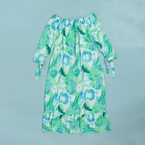 Elegant floral print maxi dress featuring a ruffle hem and tie-cuff long sleeves detail