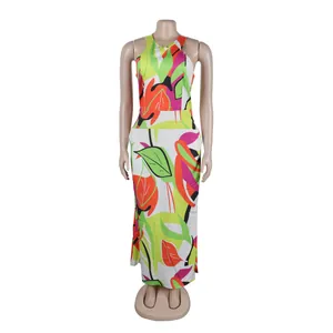Full-length view of a slim-fit maxi dress featuring a vibrant tropical leaf print.