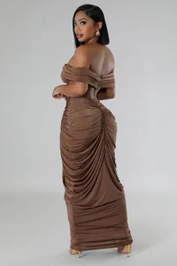 Detail view showing the back of a brown ruched maxi skirt and off-shoulder top set