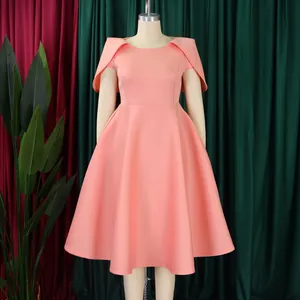 Peach pink elegant banquet dress with unique cape-style sleeves and full swing skirt.